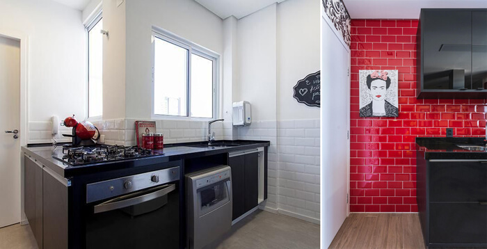 imagem de uma cozinha preta com azulejos a vista brancos e vermelhos