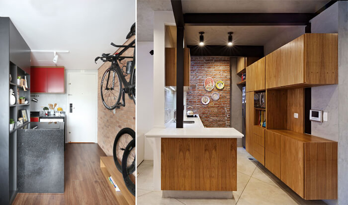 imagem de uma cozinha com revestimento em madeira e parede de tijolos à vista